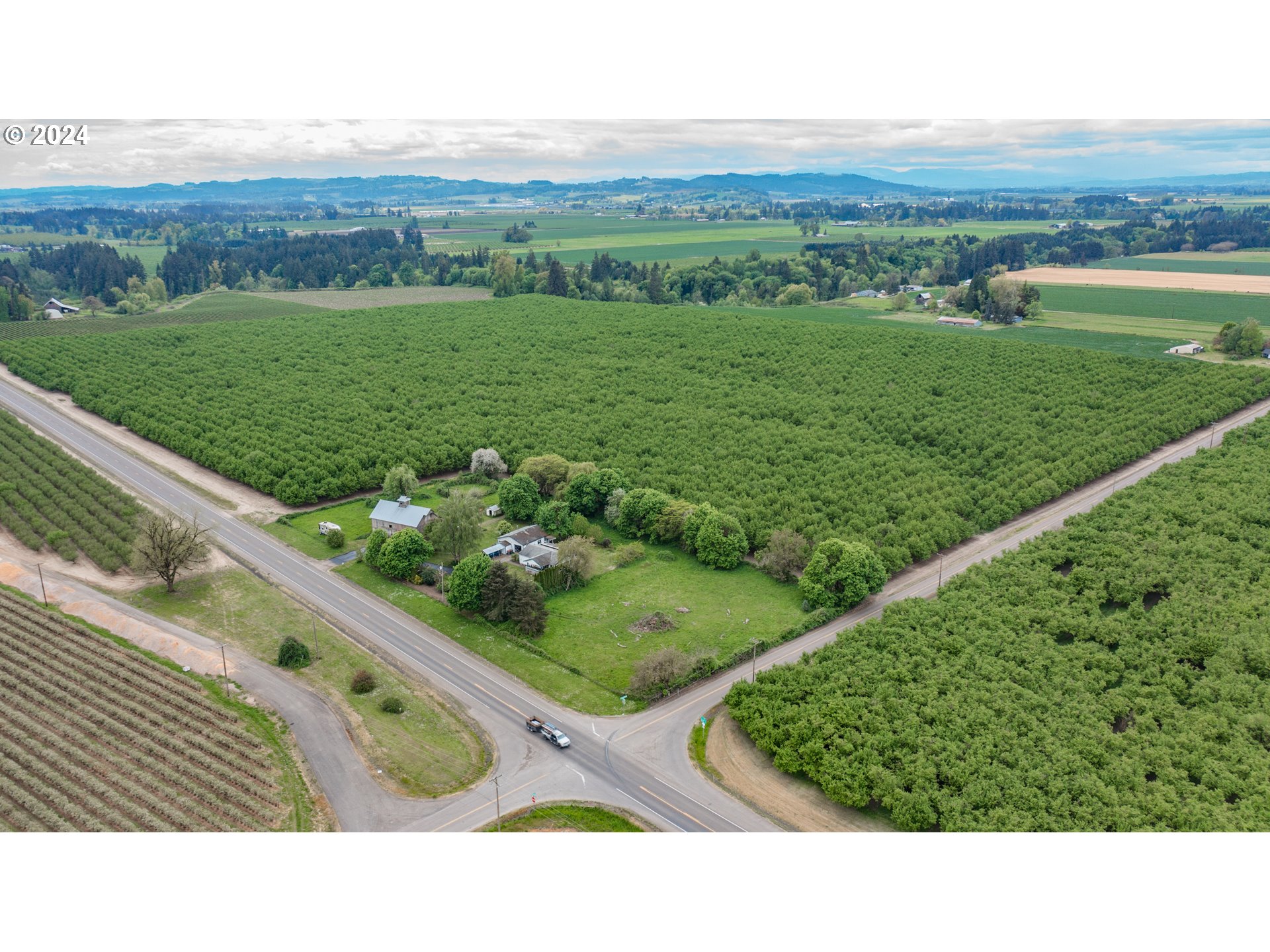 8560 Southeast Wallace Road Dayton, OR 97114 - Photo 1 of 48 a view of a field with grassy field