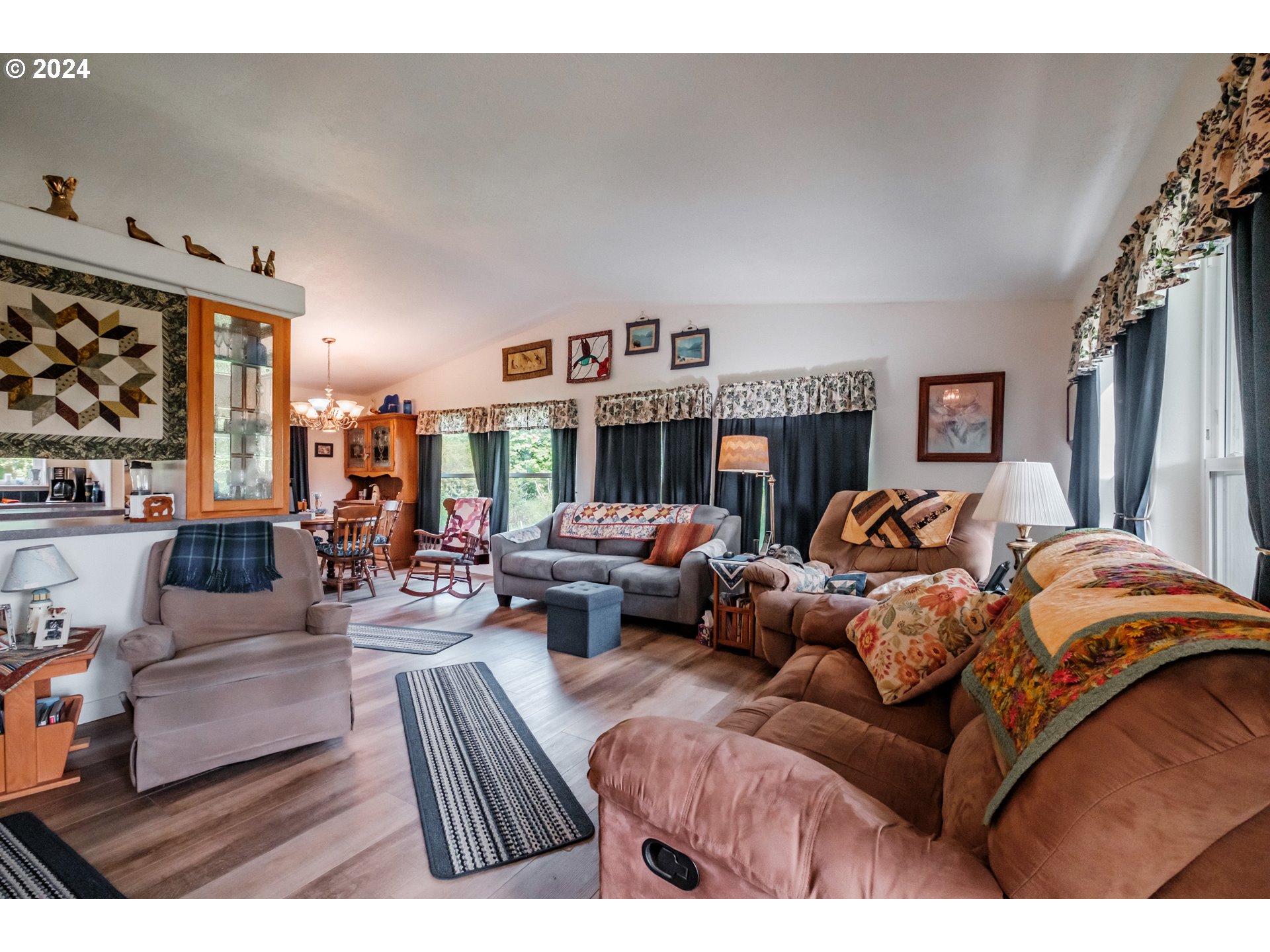 8560 Southeast Wallace Road Dayton, OR 97114 - Photo 15 of 48 a living room with furniture and large windows