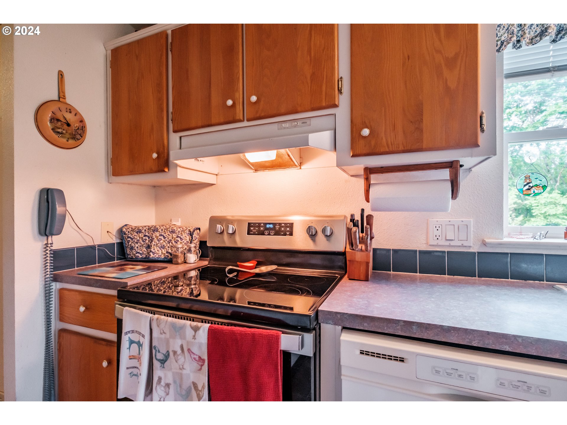 8560 Southeast Wallace Road Dayton, OR 97114 - Photo 23 of 48 a kitchen with a stove and a cabinet