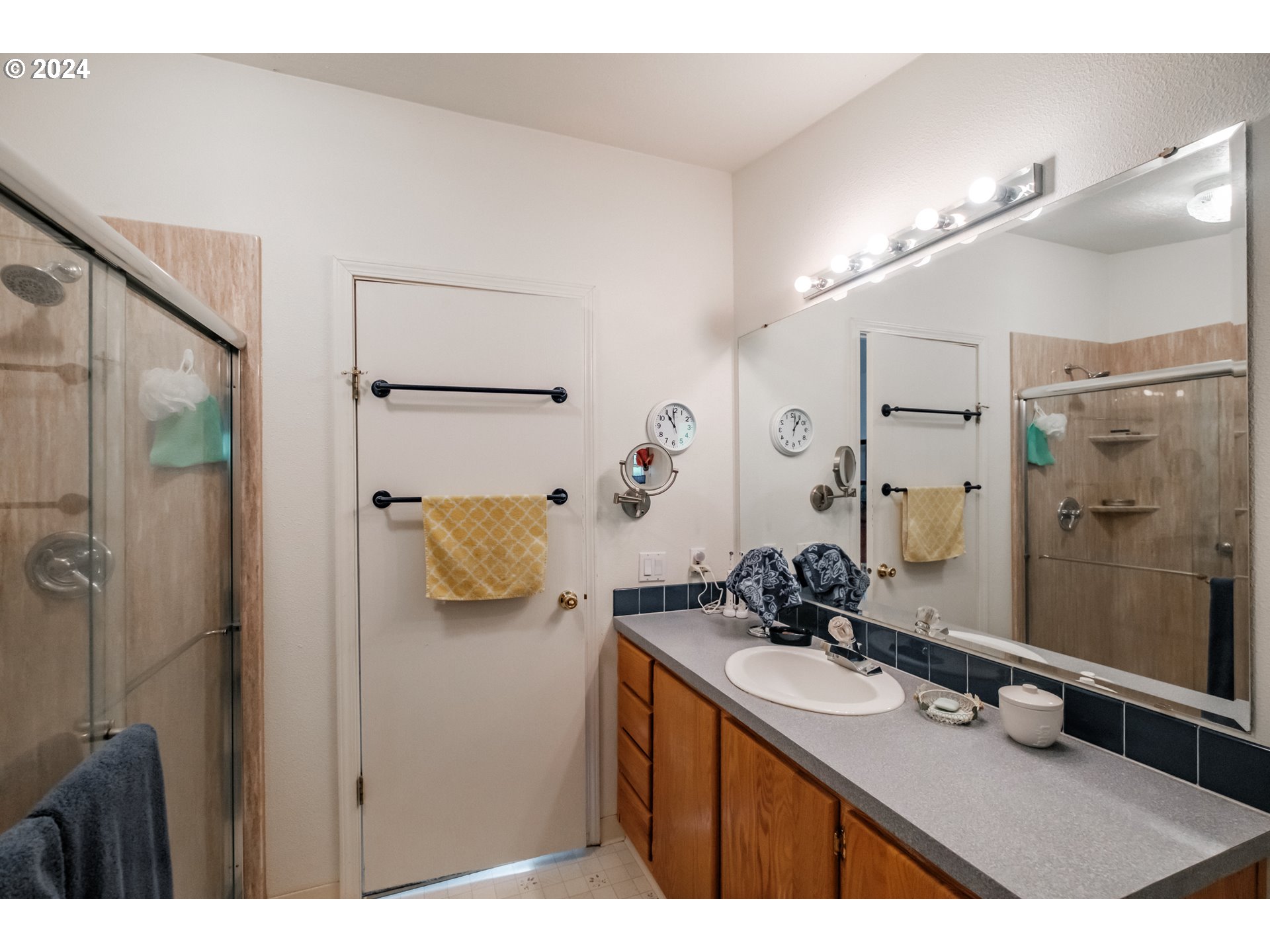 8560 Southeast Wallace Road Dayton, OR 97114 - Photo 27 of 48 a bathroom with a sink double vanity and shower
