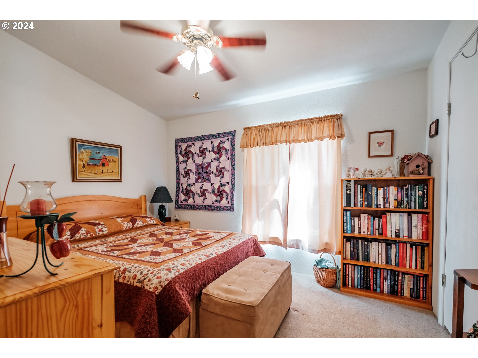 8560 Southeast Wallace Road Dayton, OR 97114 - Photo 28 of 48 a bedroom with a bed a book shelf and a window