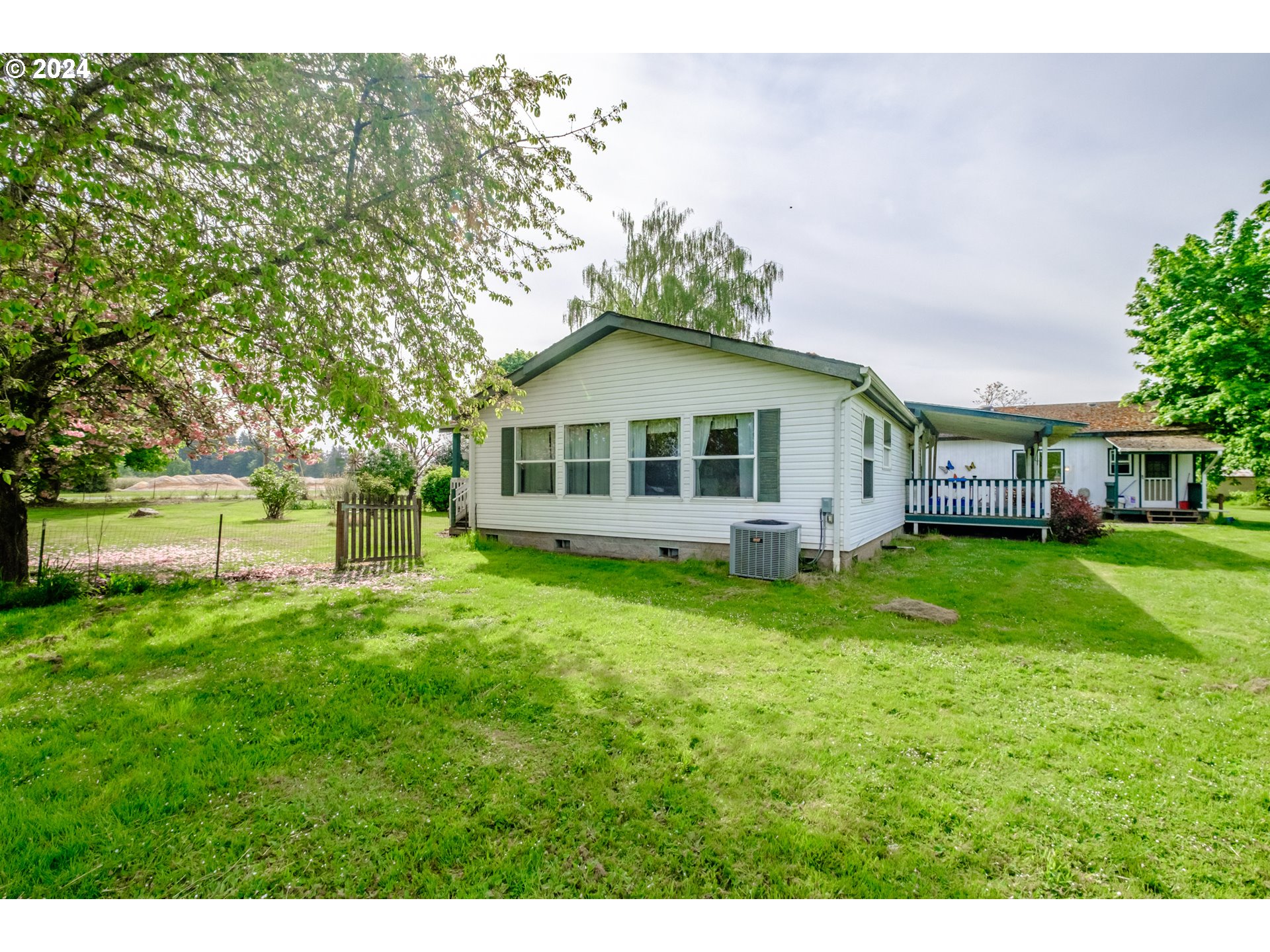 8560 Southeast Wallace Road Dayton, OR 97114 - Photo 35 of 48 a view of a house with a big yard potted plants and large tree