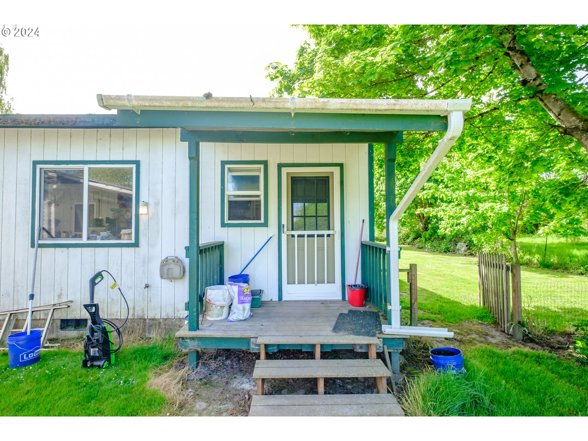 8560 Southeast Wallace Road Dayton, OR 97114 - Photo 36 of 48 a house view with a sitting space and garden space