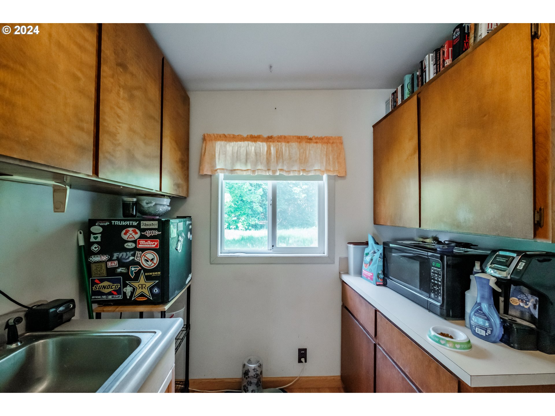 8560 Southeast Wallace Road Dayton, OR 97114 - Photo 42 of 48 a kitchen with a sink a stove and a window