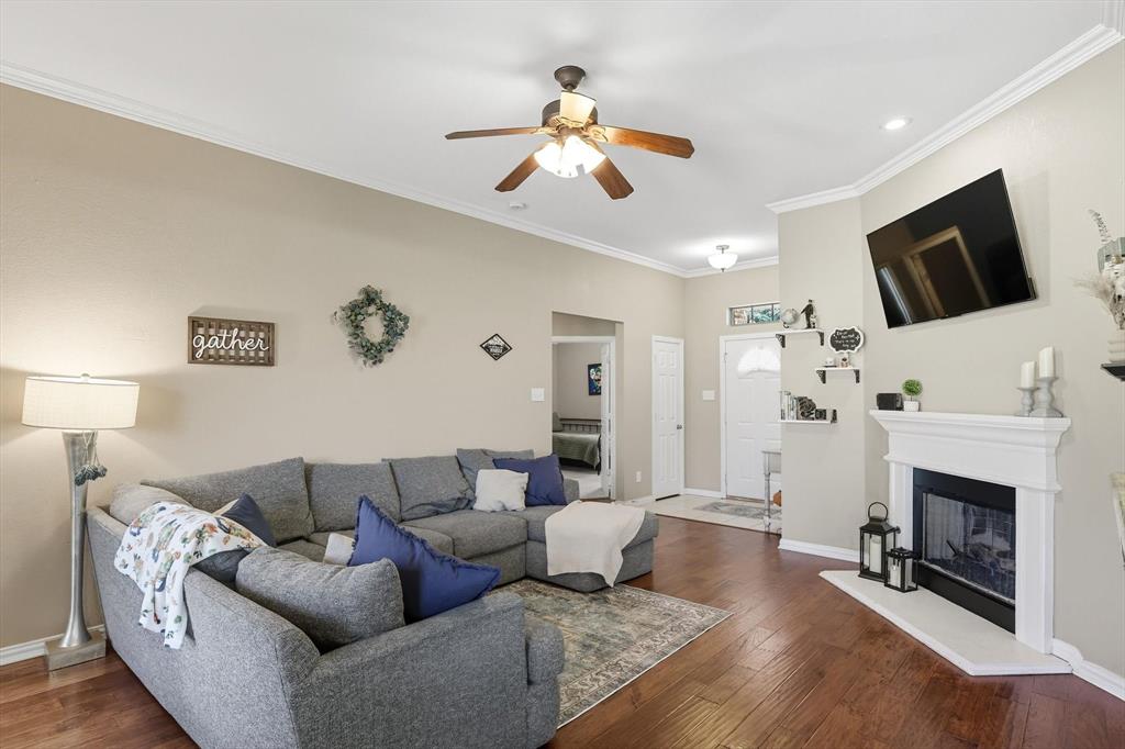 100 Turtle Dove Krum, TX 76249 - Photo 16 of 40 a living room with furniture and a fireplace