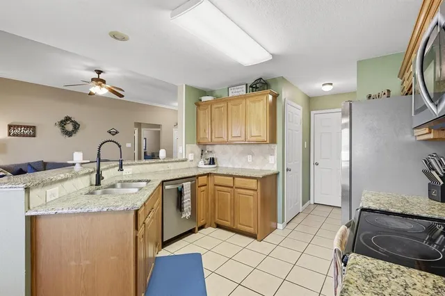 a spacious bathroom with a sink double vanity and a mirror