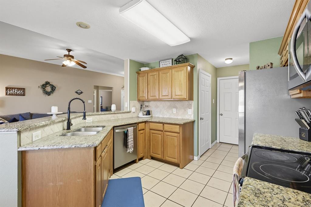 100 Turtle Dove Krum, TX 76249 - Photo 18 of 40 a spacious bathroom with a sink double vanity and a mirror