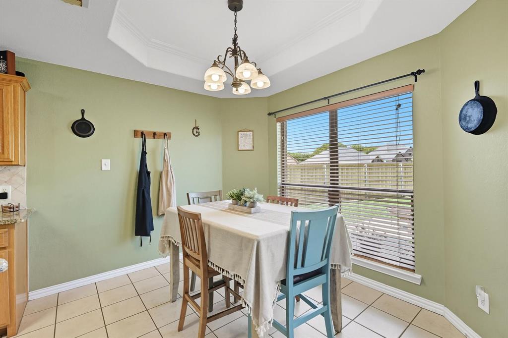 100 Turtle Dove Krum, TX 76249 - Photo 23 of 40 a view of a dining room with furniture and a chandelier