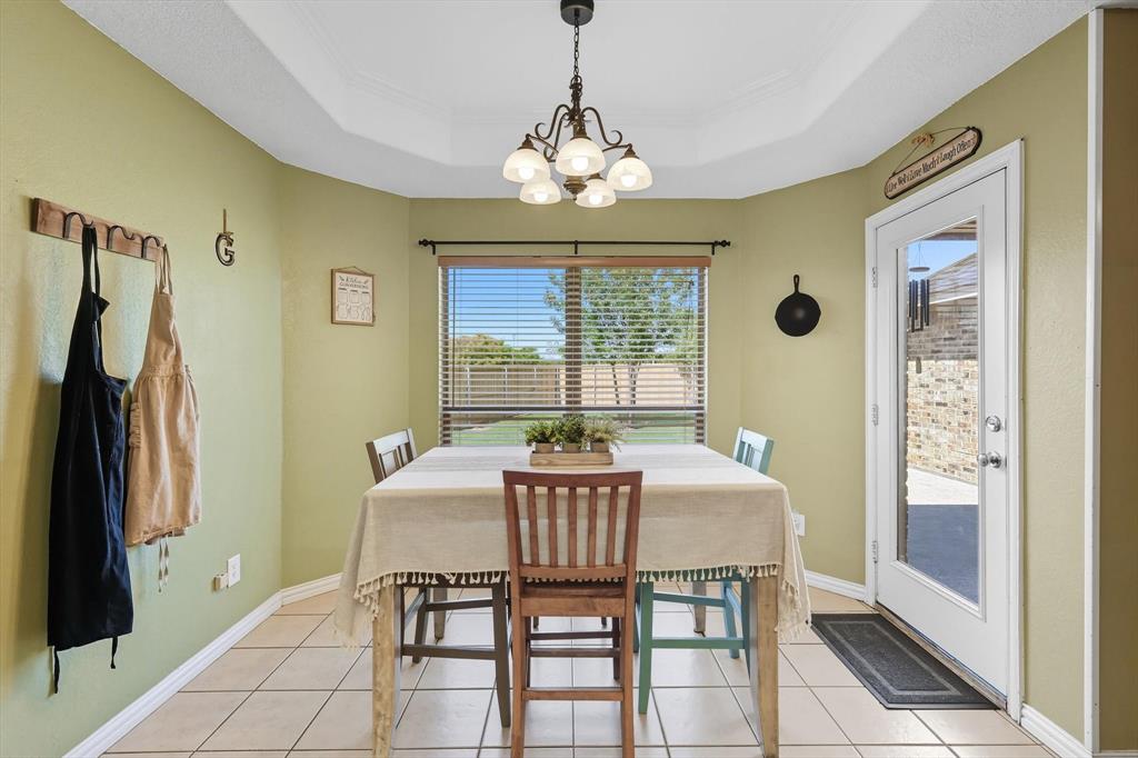 100 Turtle Dove Krum, TX 76249 - Photo 25 of 40 a dining room with furniture and window