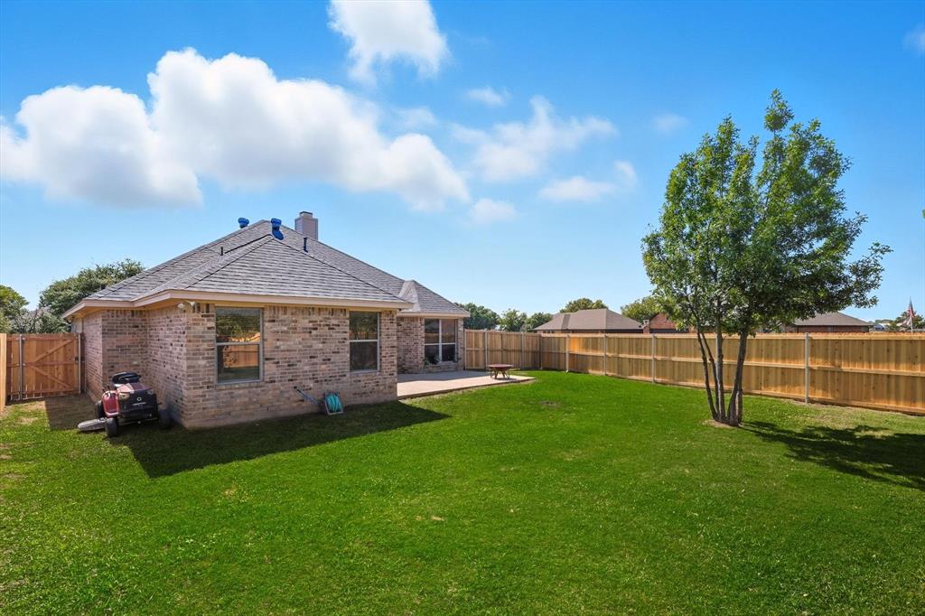 100 Turtle Dove Krum, TX 76249 - Photo 30 of 40 a view of a house with a yard