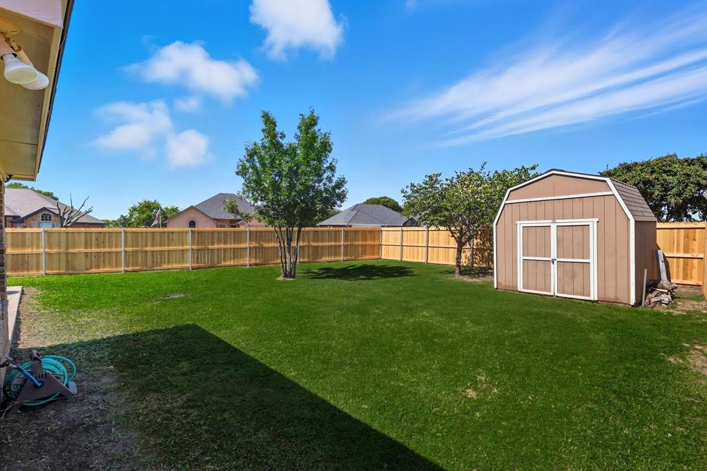 100 Turtle Dove Krum, TX 76249 - Photo 31 of 40 a view of a garden with a house in the background