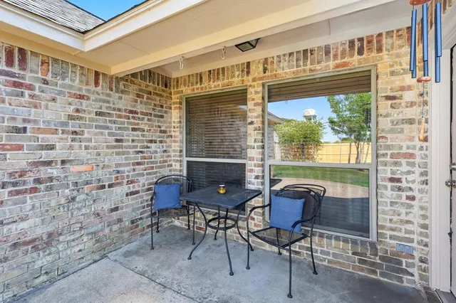 an aerial view of a house with yard swimming pool and outdoor seating