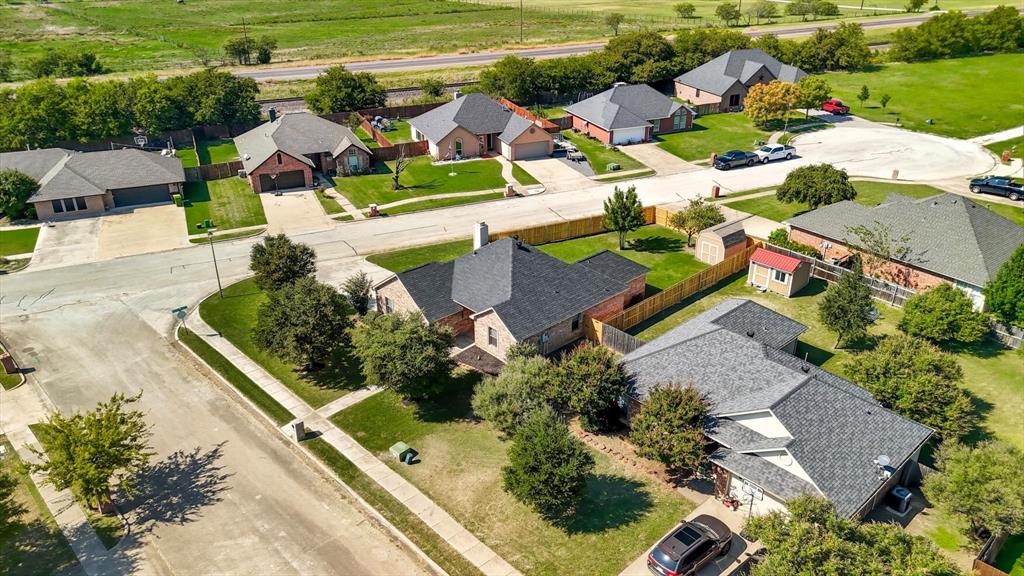 100 Turtle Dove Krum, TX 76249 - Photo 38 of 40 an aerial view of a house with a garden and lake view
