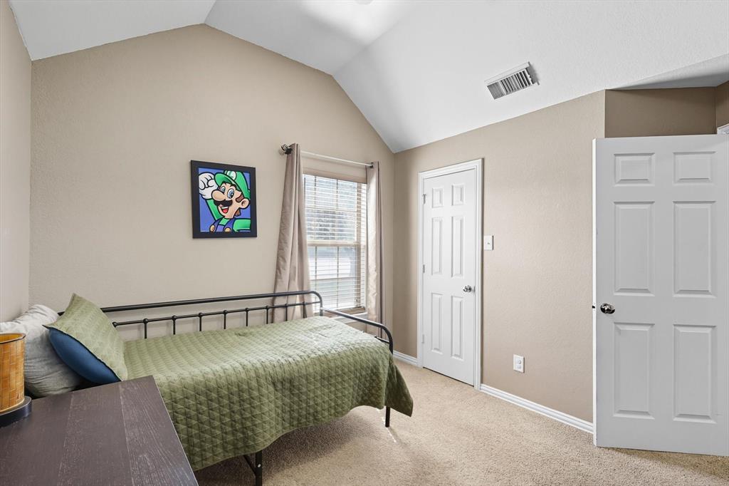 100 Turtle Dove Krum, TX 76249 - Photo 8 of 40 a bedroom with a bed and painting on the wall