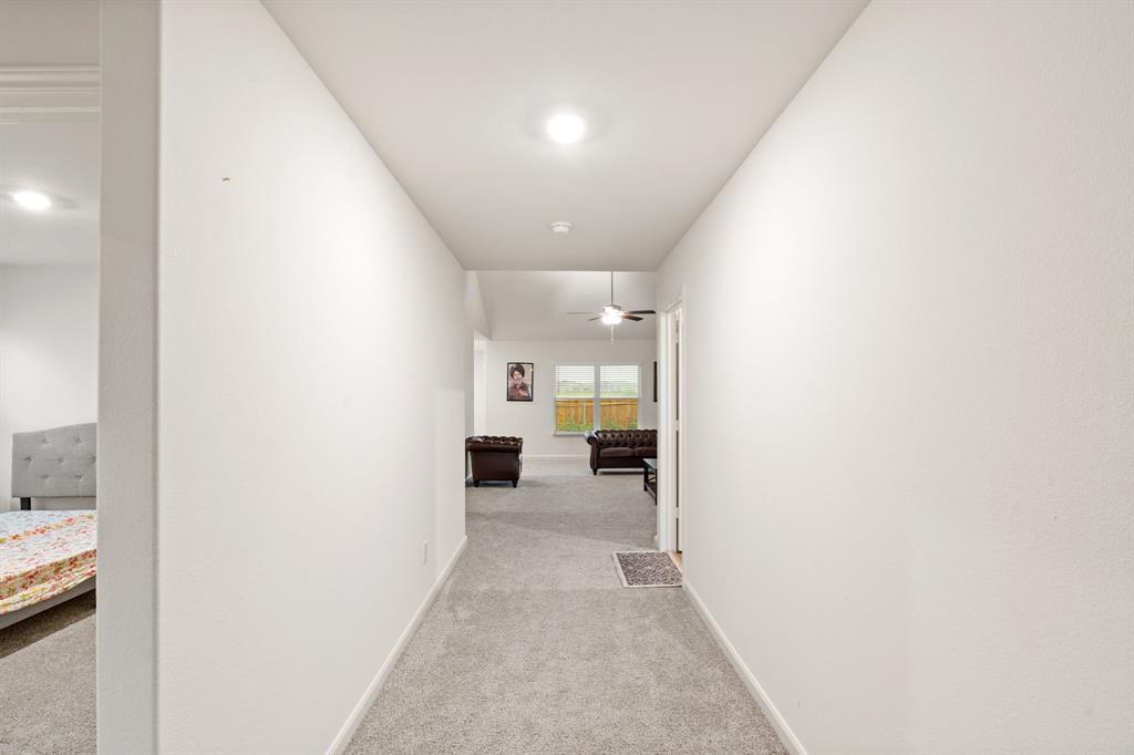 8216 Columbia Falls Road Ponder, TX 76259 - Photo 16 of 28 Hall featuring baseboards and light colored carpet