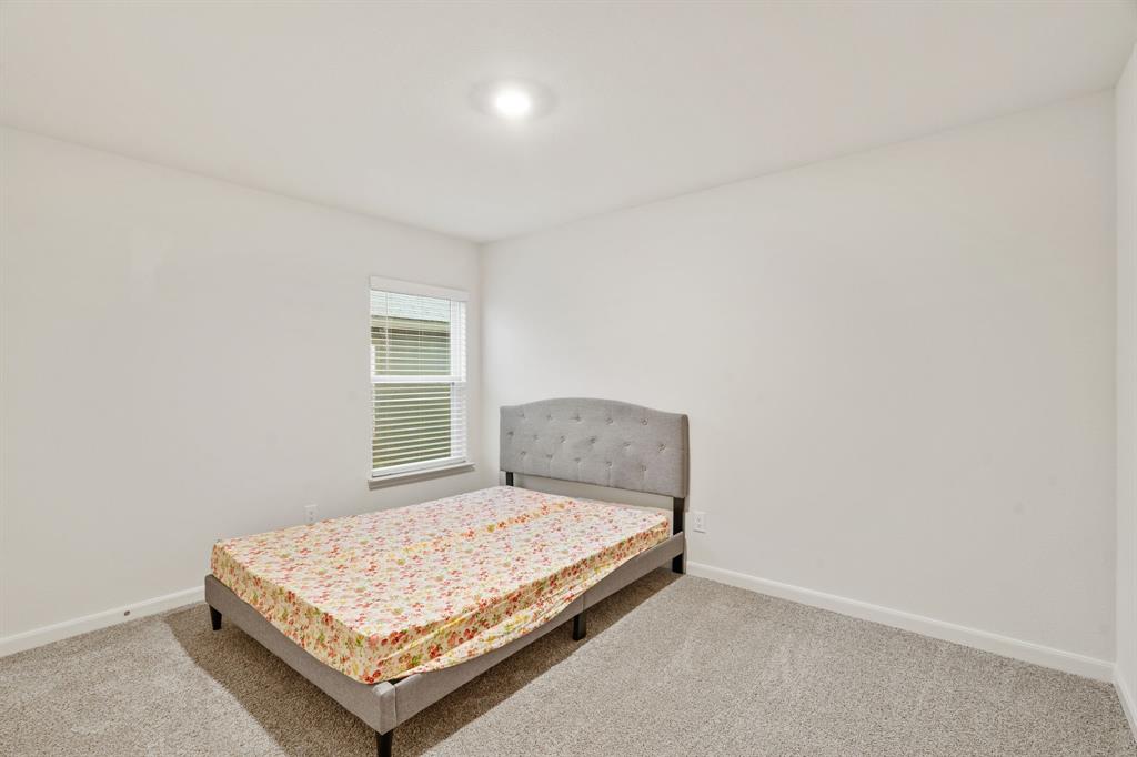 8216 Columbia Falls Road Ponder, TX 76259 - Photo 18 of 28 Carpeted bedroom with baseboards