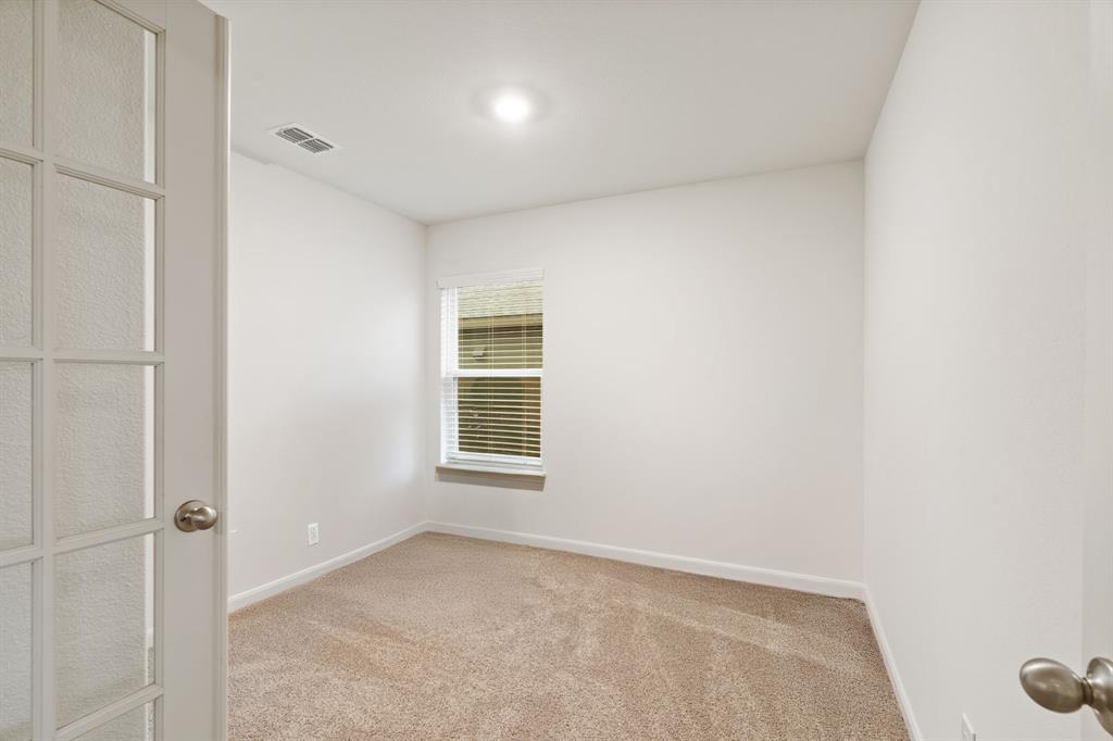 8216 Columbia Falls Road Ponder, TX 76259 - Photo 20 of 28 Carpeted spare room featuring baseboards and visible vents