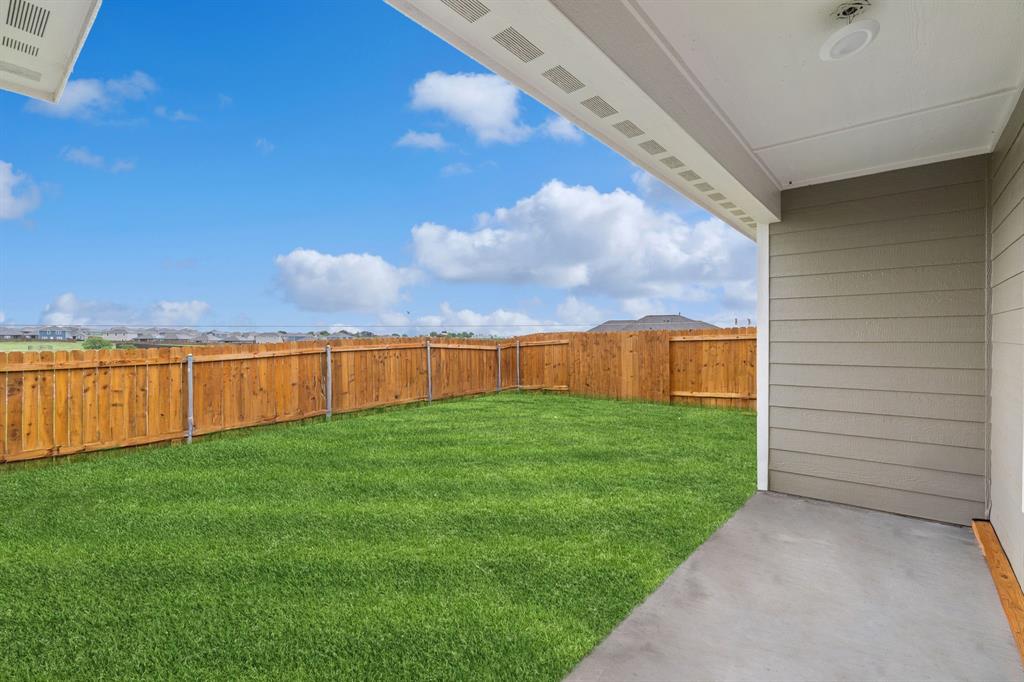 8216 Columbia Falls Road Ponder, TX 76259 - Photo 27 of 28 View of yard with a fenced backyard and a patio