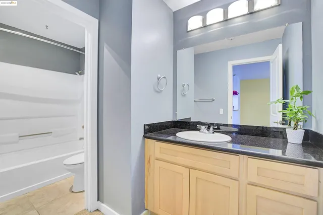 a bathroom with a toilet and a bathtub