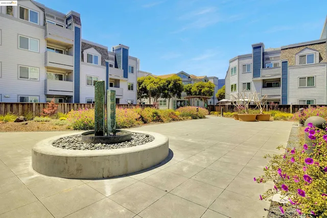 a room with furniture and pool table