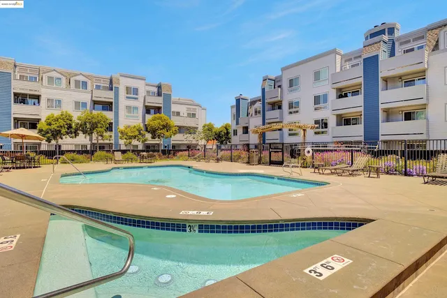a view of a building with outdoor space and sitting area