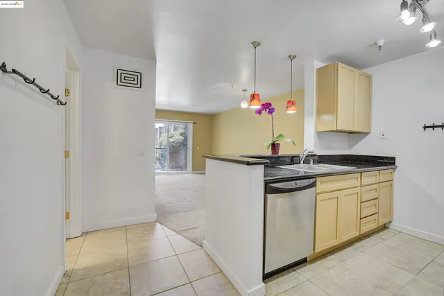 a kitchen with stainless steel appliances granite countertop a sink and cabinets