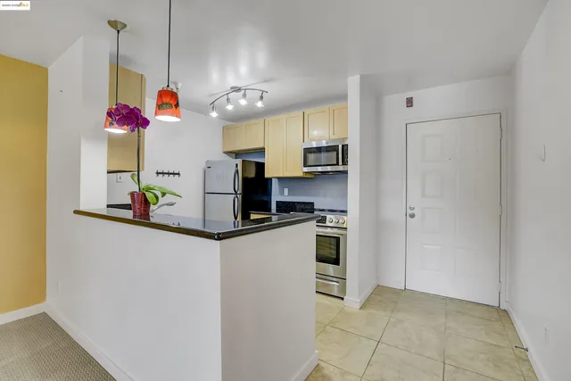 a kitchen view of microwave and stove