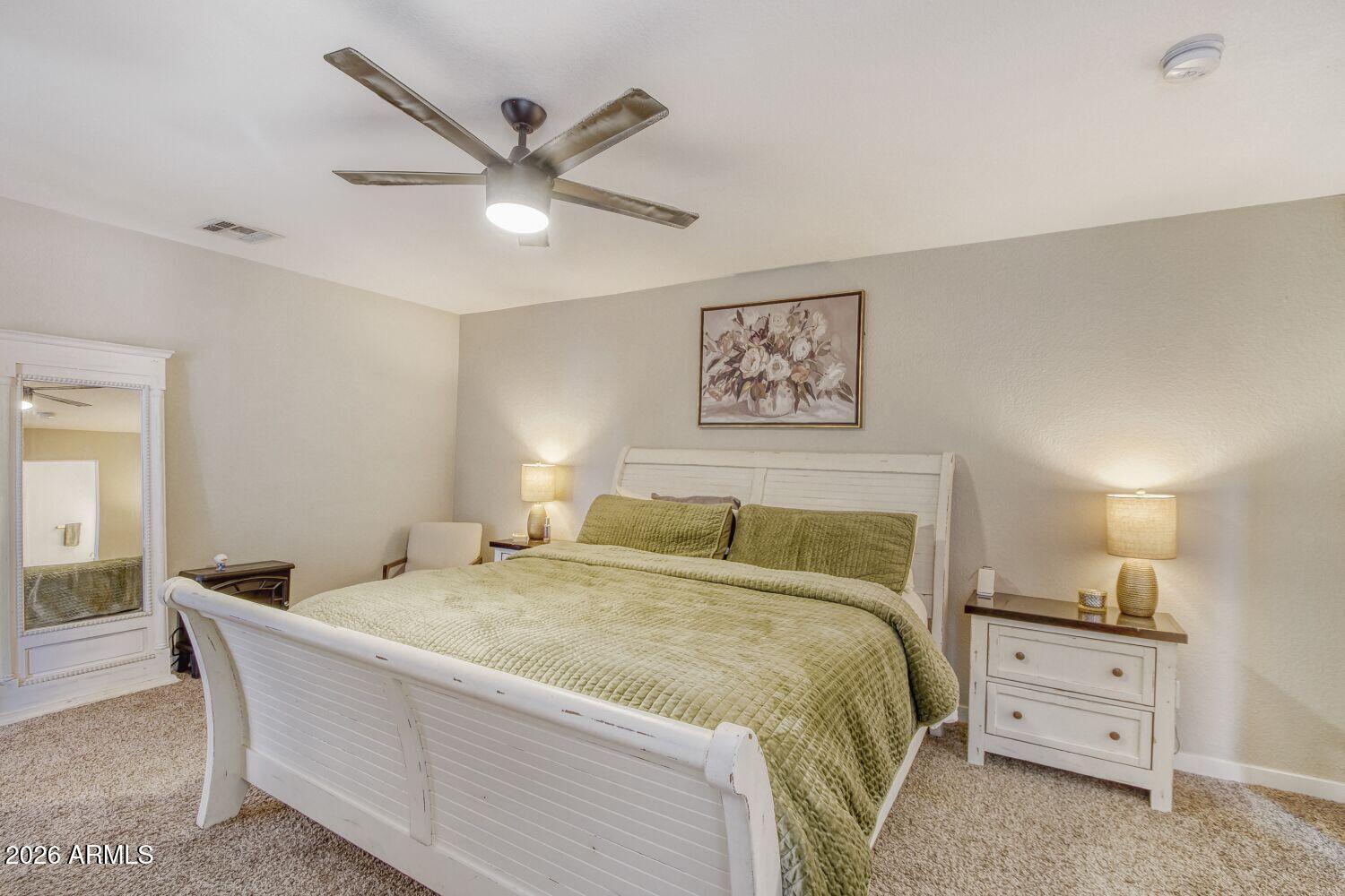 720 West Thunderbird Road Phoenix, AZ 85023 - Photo 14 of 28 a bedroom with a bed and a ceiling fan