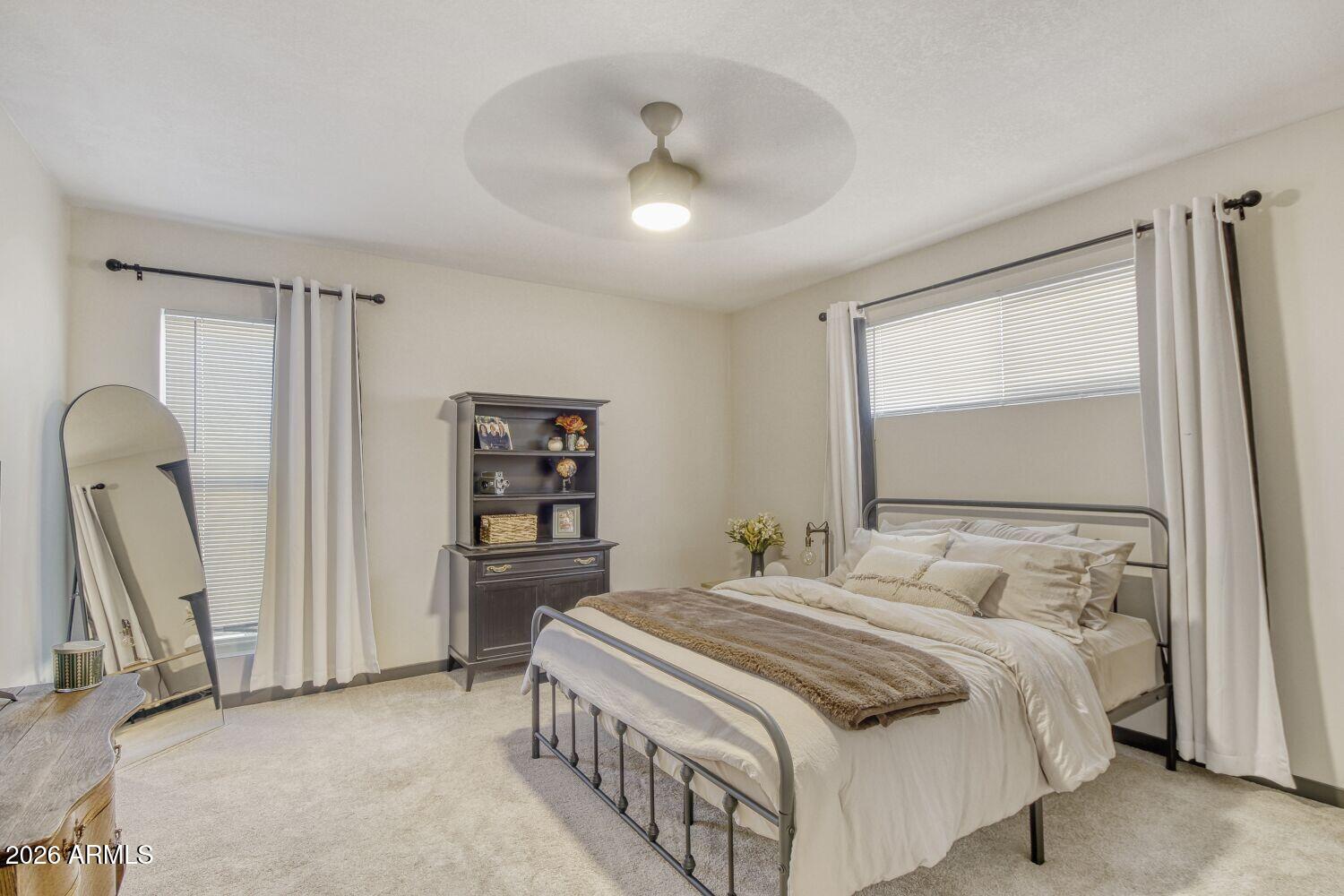 720 West Thunderbird Road Phoenix, AZ 85023 - Photo 16 of 28 a bedroom with a bed next to a window