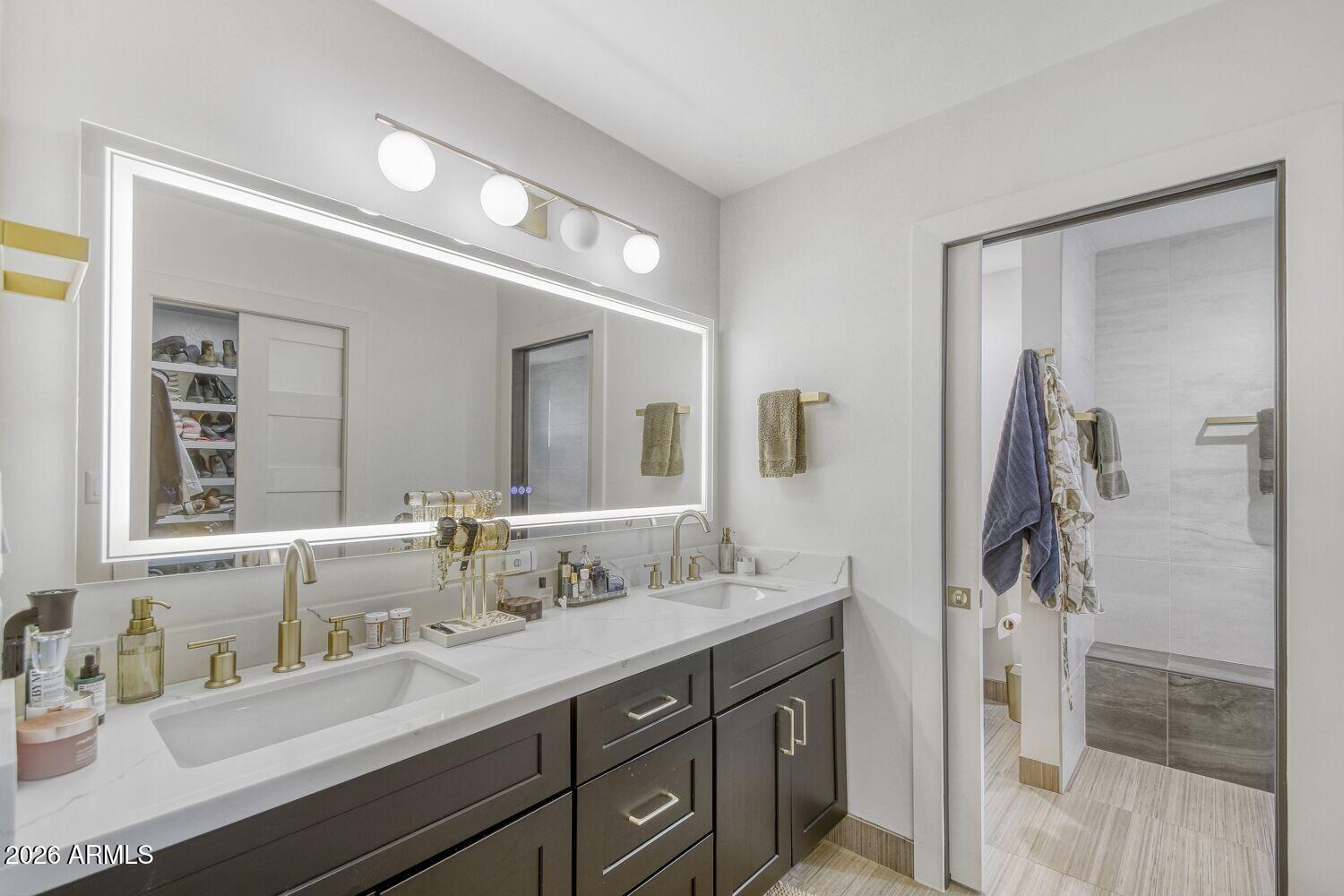 720 West Thunderbird Road Phoenix, AZ 85023 - Photo 17 of 28 a bathroom with a double vanity sink a and mirror
