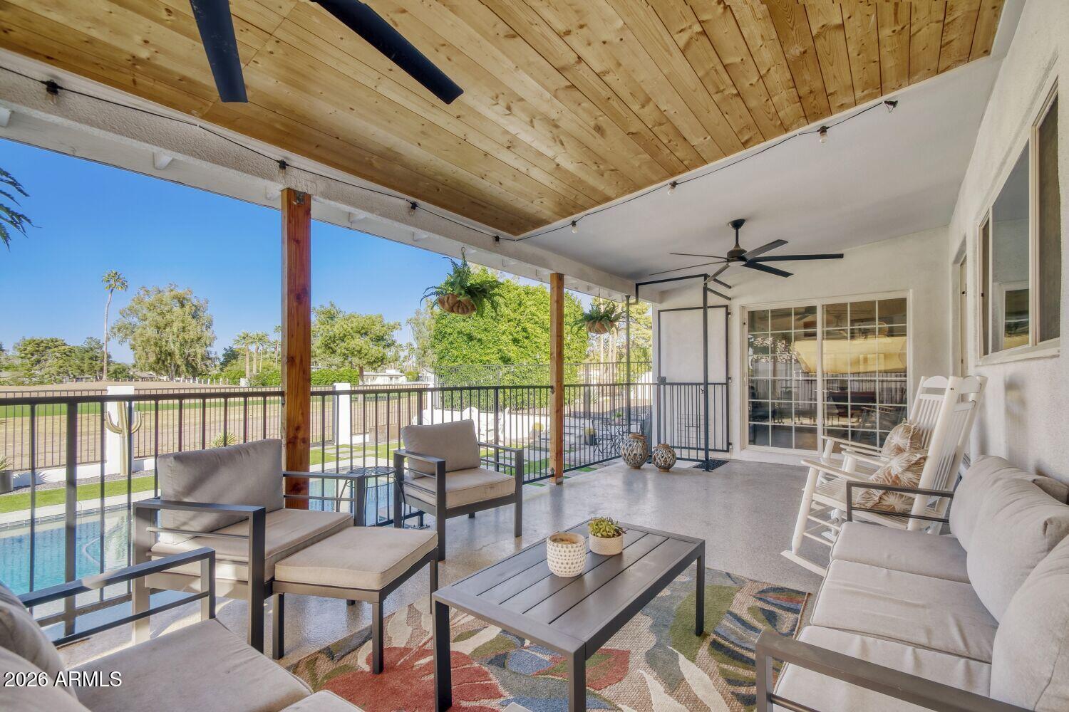 720 West Thunderbird Road Phoenix, AZ 85023 - Photo 20 of 28 a living room with furniture and a floor to ceiling window