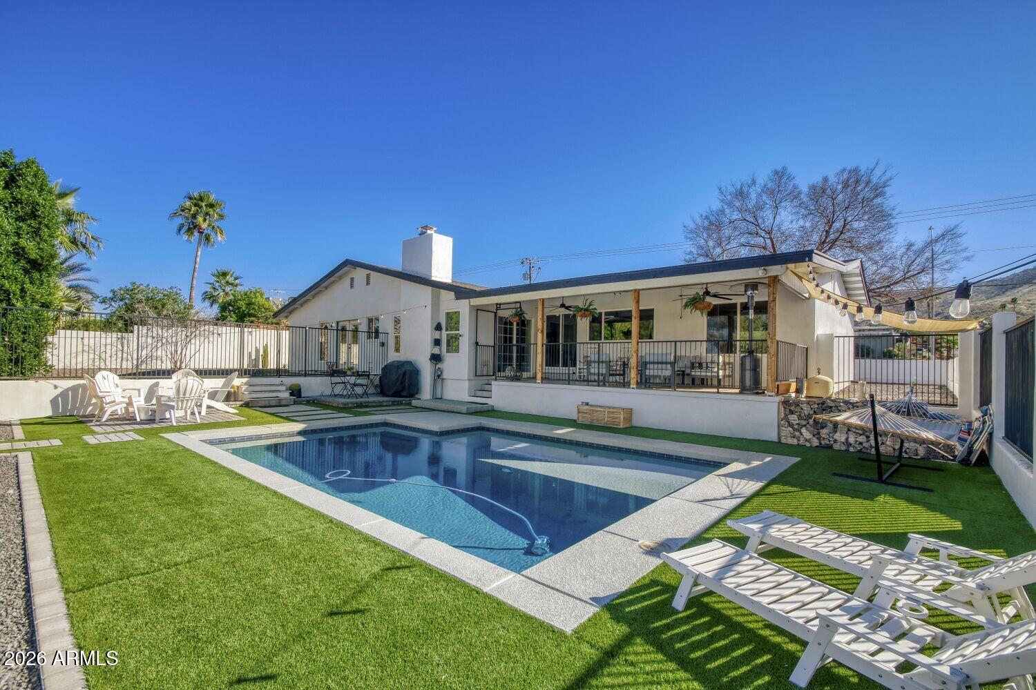 720 West Thunderbird Road Phoenix, AZ 85023 - Photo 24 of 28 swimming pool view with a seating space and garden