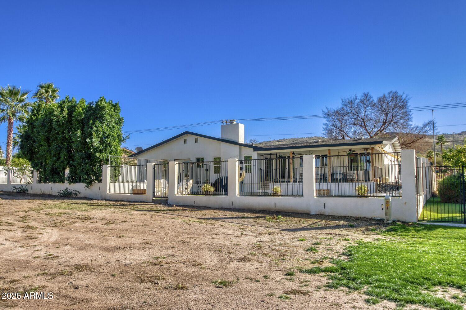 720 West Thunderbird Road Phoenix, AZ 85023 - Photo 25 of 28 a front view of a house with a yard
