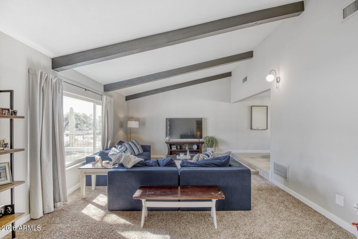 720 West Thunderbird Road Phoenix, AZ 85023 - Photo 7 of 28 a living room with furniture and a large window