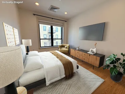 a open kitchen with stainless steel appliances granite countertop a stove and a refrigerator