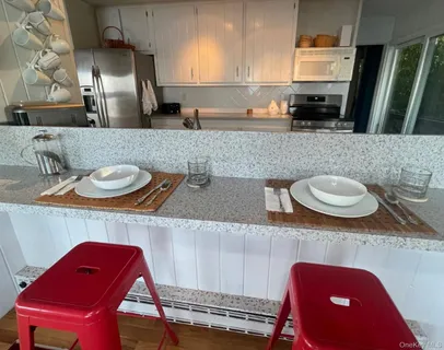 a kitchen with stainless steel appliances a refrigerator and a sink
