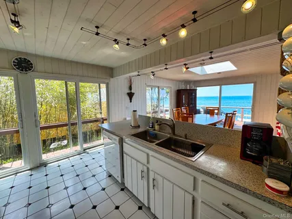 a bedroom with two beds and a large window