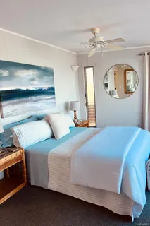 a bed room with a bed and a large window