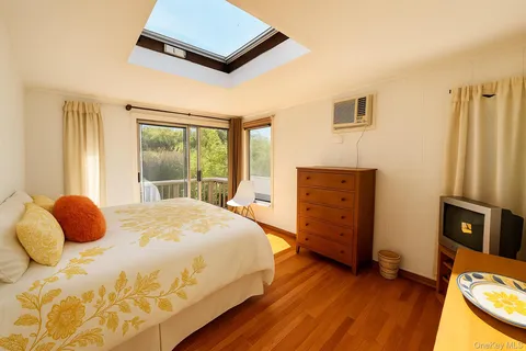 a bedroom with a bed and window