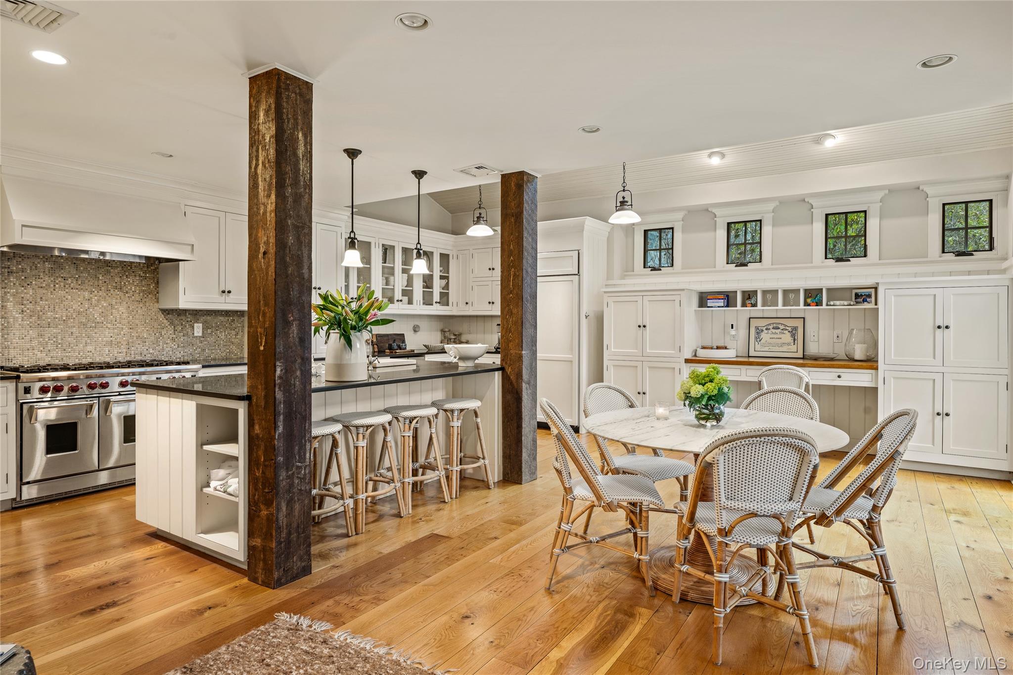 440 Long Ridge Road Pound Ridge, NY 10576 - Photo 15 of 28 a kitchen with stainless steel appliances kitchen island granite countertop a table and chairs