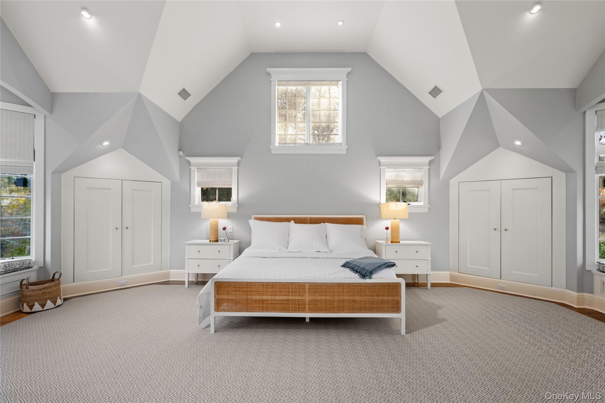 440 Long Ridge Road Pound Ridge, NY 10576 - Photo 19 of 28 a spacious bedroom with a bed and a cabinets