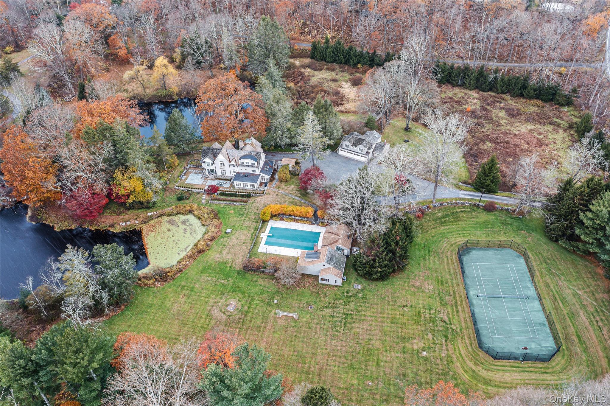 440 Long Ridge Road Pound Ridge, NY 10576 - Photo 2 of 28 an aerial view of a house with outdoor space