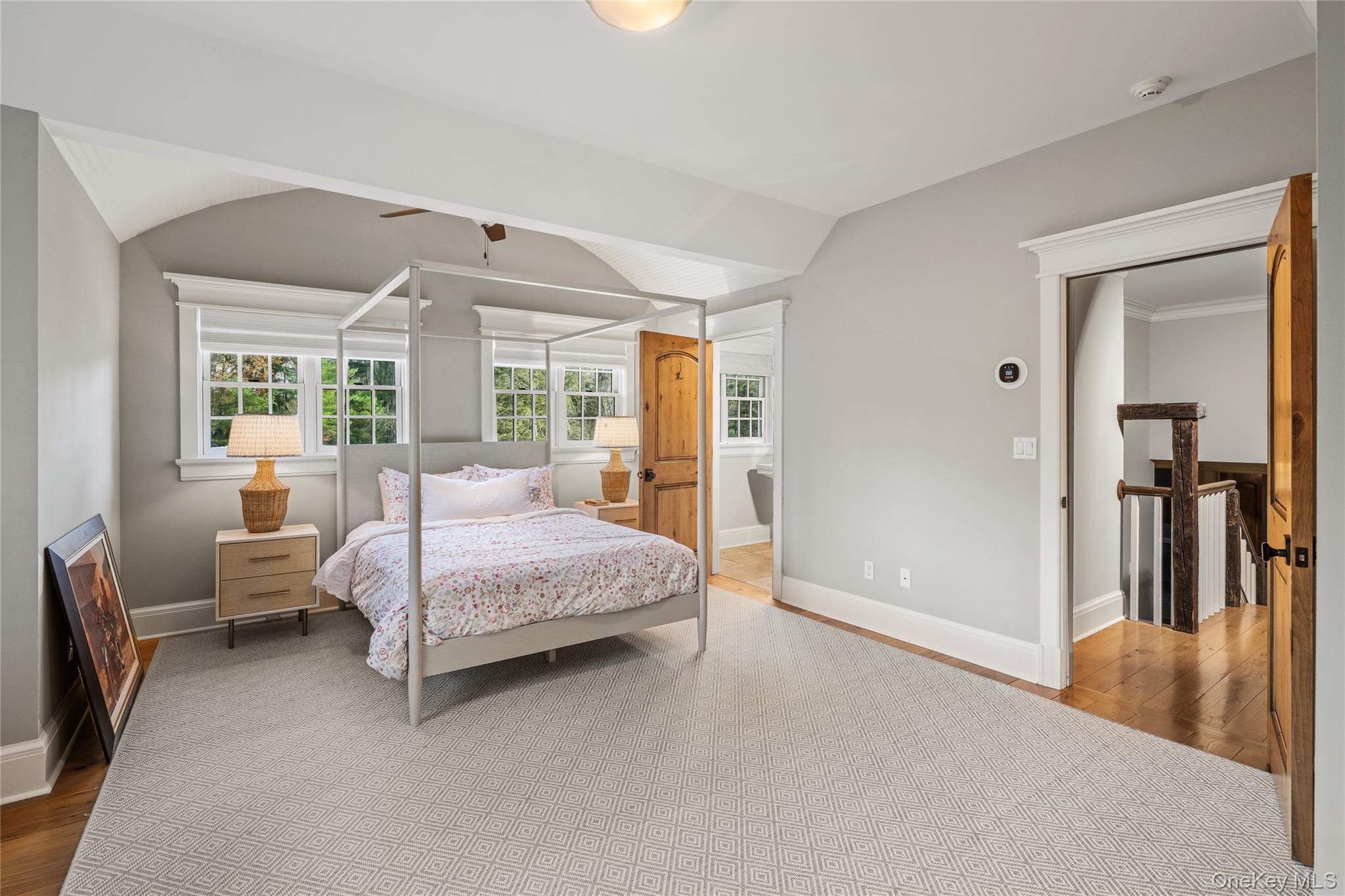440 Long Ridge Road Pound Ridge, NY 10576 - Photo 21 of 28 a bedroom with a bed and large window