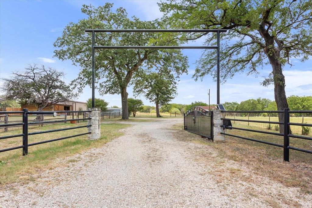174 Ross Rd Spur Waco, TX 76705 - Photo 7 of 40 Solar-powered electric gate at road entrance with keypad