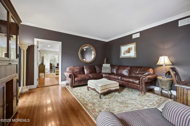 a bathroom with a tub a mirror and a sink