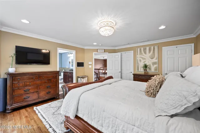 a bedroom with bed and a table