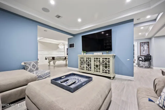 a bathroom with a toilet sink vanity granite and mirror