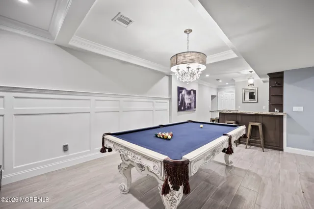 a view of a patio with table and chairs potted plants with wooden floor