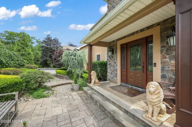 a view of an entryway with wooden floor and door