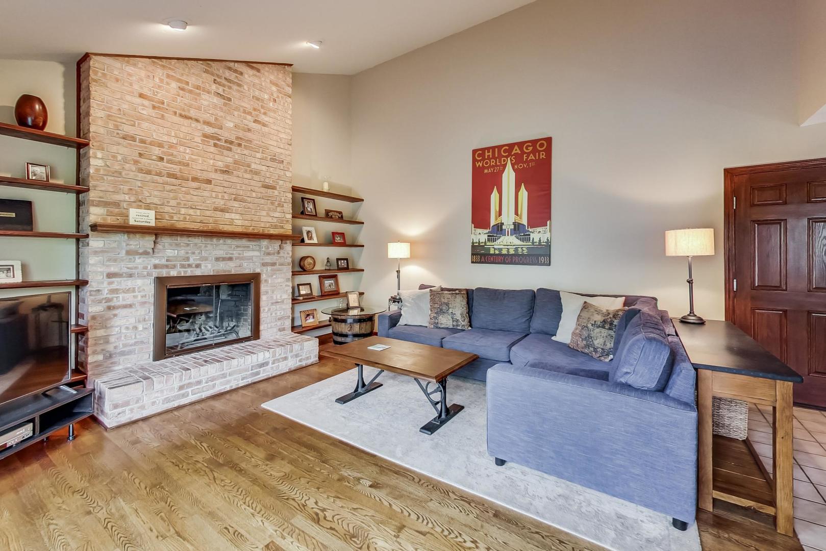 482 West 3rd Street Elmhurst, IL 60126 - Photo 16 of 39 a living room with furniture and a fireplace
